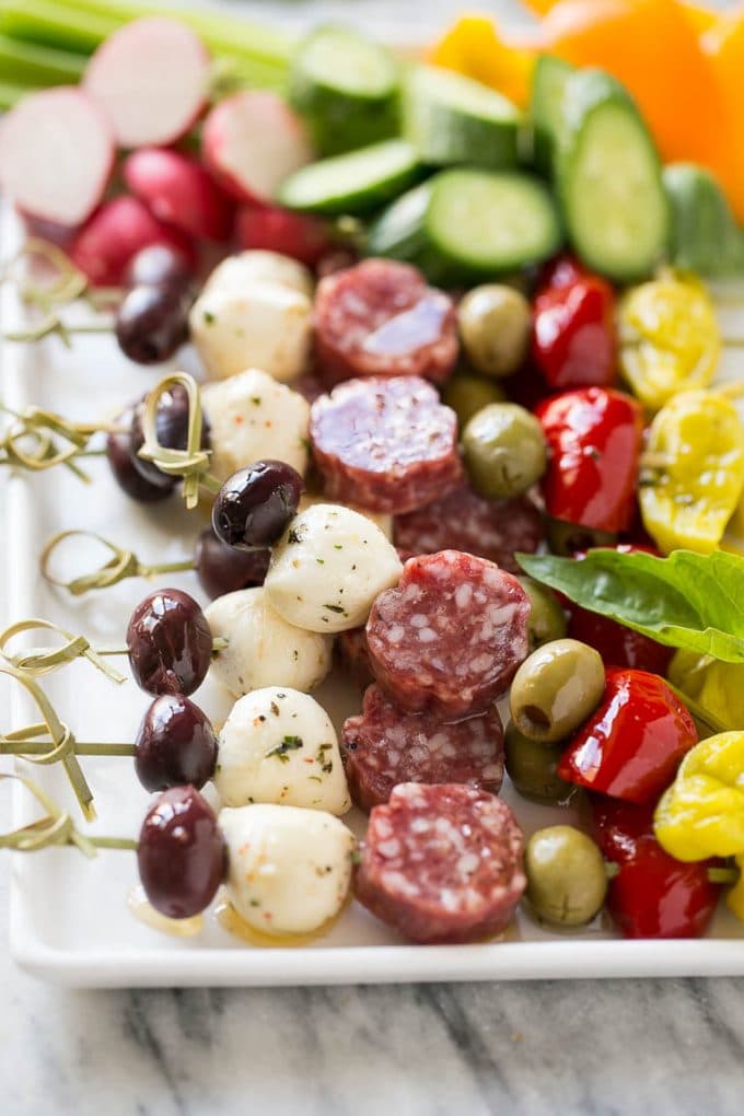 Antipasto Skewers Recipe | Easy Antipasto | Best Antipasto #antipasto #skewers #appetizer #fuyos Antipasto skewers on a white serving platter.