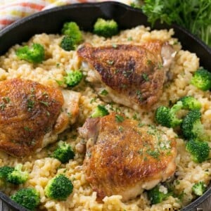 This one pot chicken with cheddar broccoli rice combines classic flavors for a quick and easy dinner. Chicken thighs are cooked with a creamy cheesy broccoli cheddar rice for a complete meal without all the cleanup.