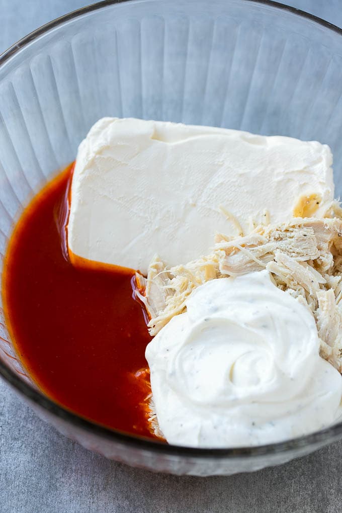 Buffalo Ranch Chicken Dip | Buffalo Chicken Dip | Baked Buffalo Dip | Cheesy Buffalo Dip #buffalowings #buffalochicken #dip #lowcarb #appetizer #fuyos Ingredients for the dip in a bowl.