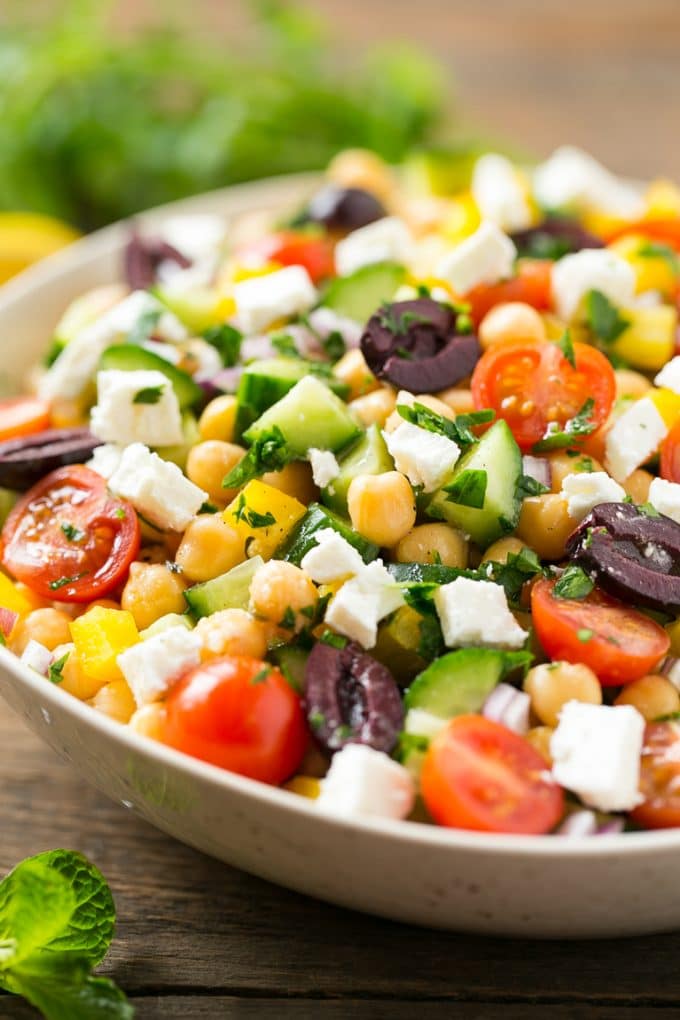 Chopped Greek salad with tomatoes, olives, cucumbers, chickpeas and feta cheese.