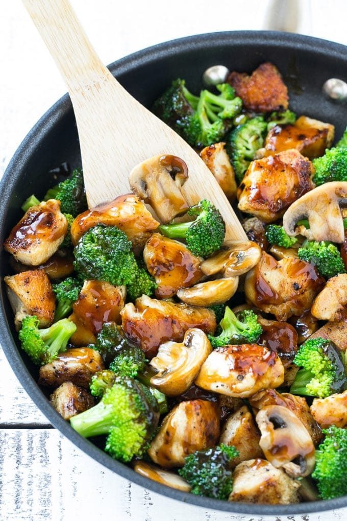 Chicken and Broccoli Stir Fry Recipe | Chicken Stir Fry | Healthy Chicken Recipe | Chicken and Broccoli | Chinese Food #chicken #broccoli #stirfry #healthy #cleaneating #dinner #fuyos Chicken and broccoli stir fry with mushrooms in a skillet with a spatula.