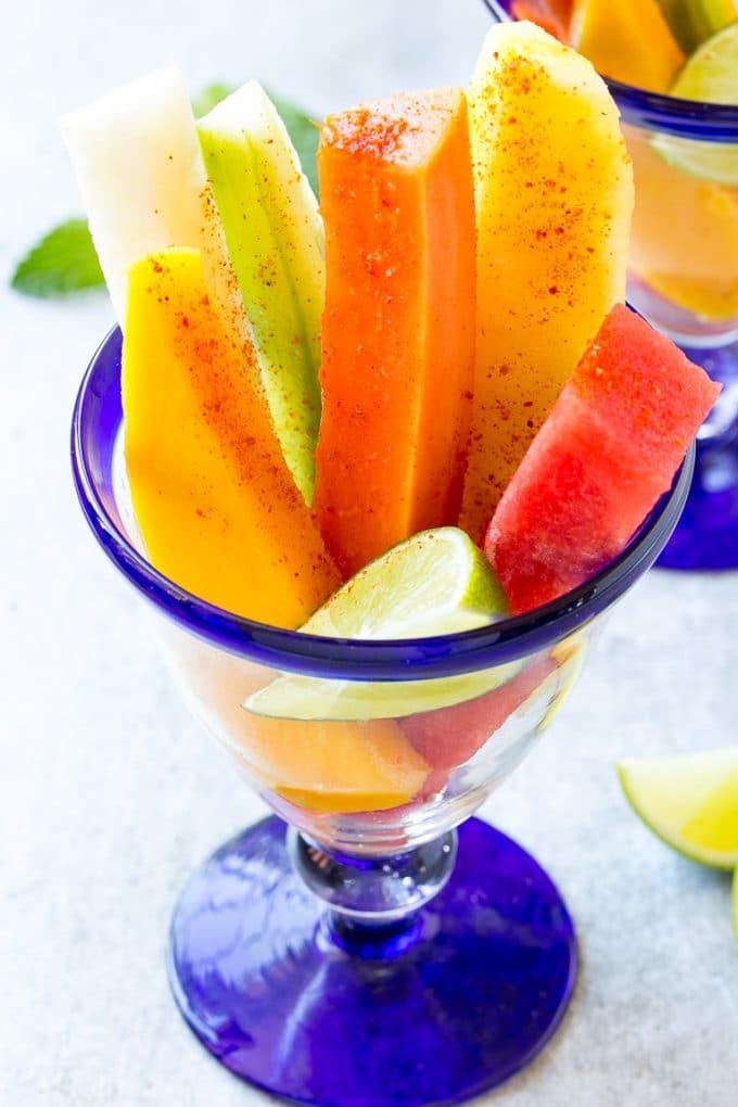 Mexican Fruit Cups | Fruit Cups | Mexican Fruit | Tropical Fruit #fruit #fruitcup #watermelon #pineapple #snack #healthy #fuyos Fruit cups filled with watermelon, cucumber, papaya and mango.