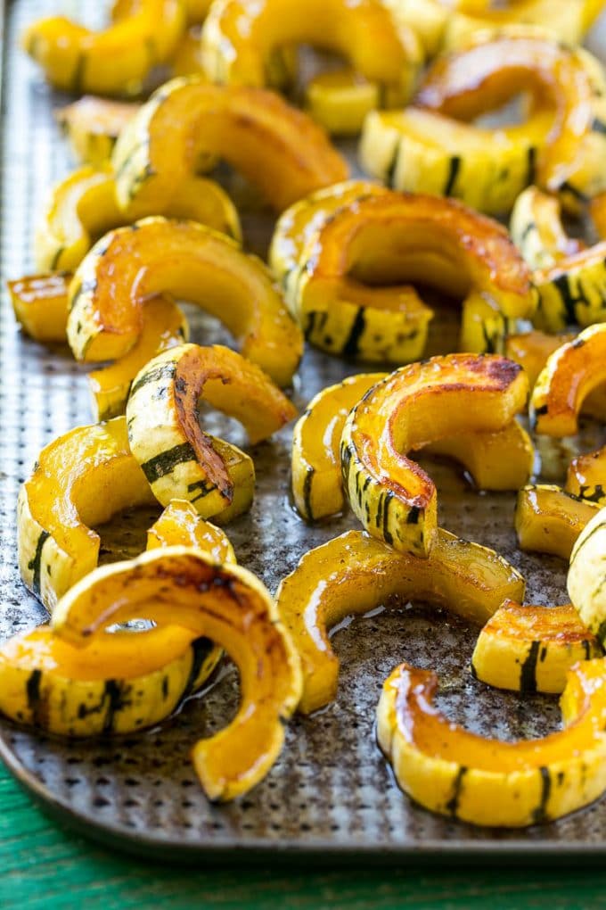 Brown Sugar Delicata Squash Recipe | Roasted Squash | Delicata Squash | Winter Squash Recipe #squash #wintersquash #brownsugar #sidedish #delicatasquash #dinner #fuyos A delicata squash recipe with brown sugar roasted squash on a sheet pan.