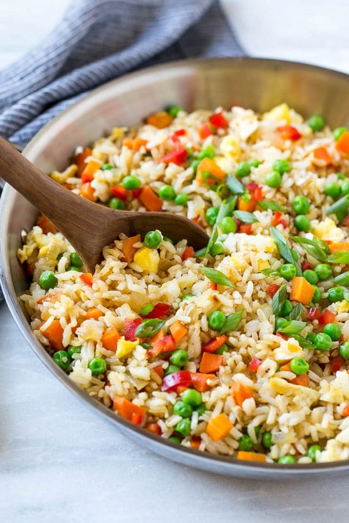 Veggie Fried Rice Recipe | Vegetarian Fried Rice | Easy Fried Rice Recipe | Chinese Food #rice #friedrice #veggie #vegetarian #sidedish #fuyos Veggie fried rice in a skillet with a serving spoon.