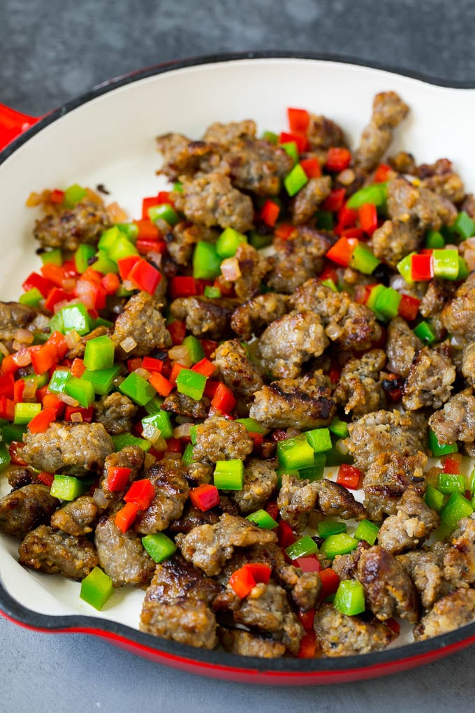 Sweet Potato Hash #sweetpotato #sausage #breakfast #brunch #fuyos Sausage, onions and bell peppers in a skillet.