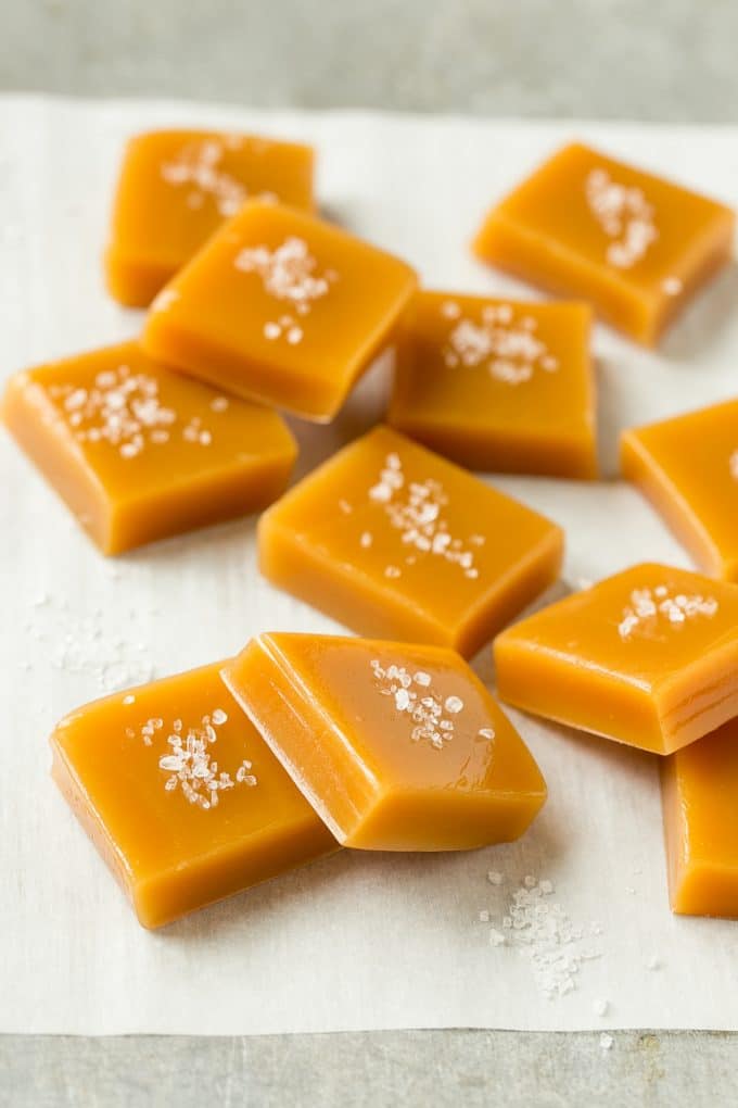 Microwave Caramels with Sea Salt Recipe | Homemade Caramels | Sea Salt Caramel | Homemade Candy #candy #caramels #caramel #microwavecaramels #homemade #dessert #fuyos Squares of caramel topped with coarse salt.