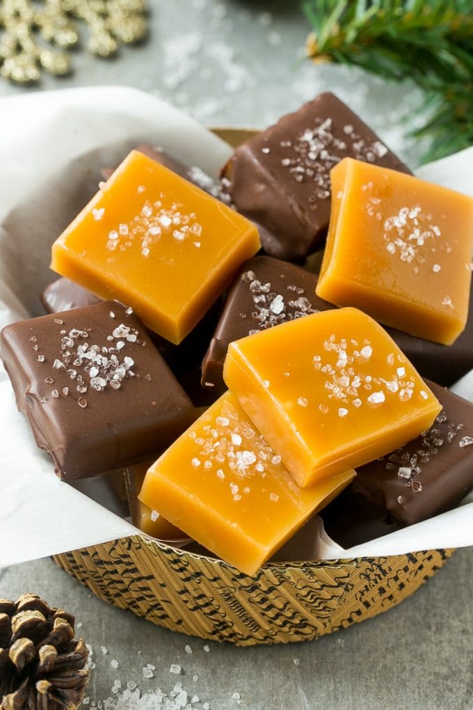 Microwave Caramels with Sea Salt Recipe | Homemade Caramels | Sea Salt Caramel | Homemade Candy #candy #caramels #caramel #microwavecaramels #homemade #dessert #fuyos A basket of microwave caramels topped with sea salt.