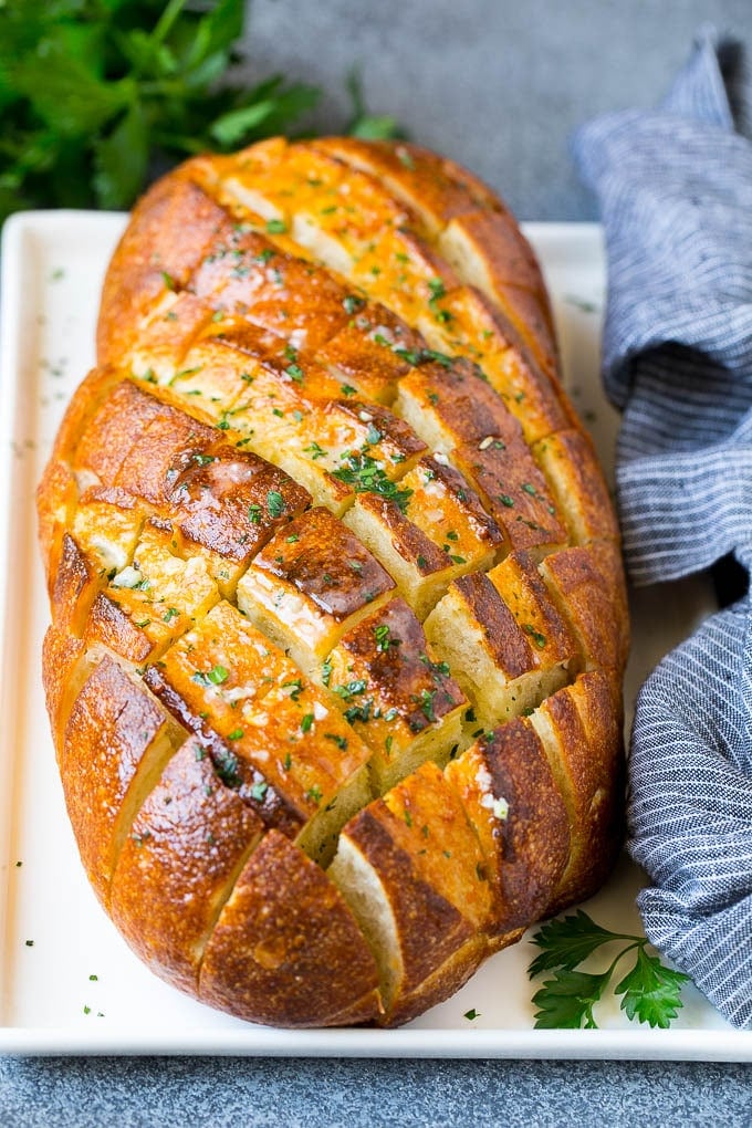 Pull Apart Bread | Garlic Bread | Cheese Bread #bread #garlic #cheese #sidedish #appetizer #fuyos Baked garlic pull apart bread garnished with parsley.