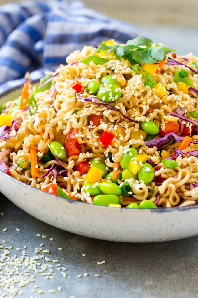 Asian Noodle Salad Recipe | Ramen Noodle Salad | Asian Salad #salad #noodles #edamame #vegetarian #fuyos #lunch A mixture of ramen noodles, carrots, edamame, cabbage and peppers in a serving bowl.