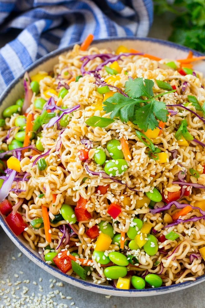 Asian Noodle Salad Recipe | Ramen Noodle Salad | Asian Salad #salad #noodles #edamame #vegetarian #fuyos #lunch A bowl of Asian noodle salad with colorful vegetables.