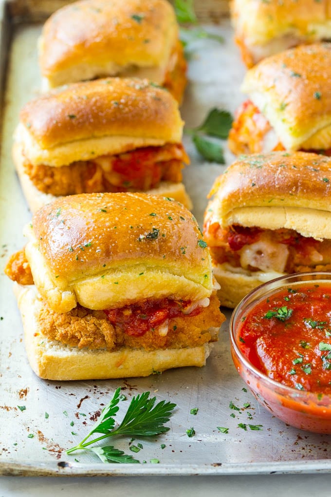 Chicken Parmesan Sliders | Chicken Parmesan Sandwich Recipe | Slider Sandwich Recipe #sliders #chickenparm #chickenparmesan #chickenparmesansliders #dinner #appetizer #fuyos Chicken parmesan sliders made with crispy chicken, marinara sauce and cheese on buns.