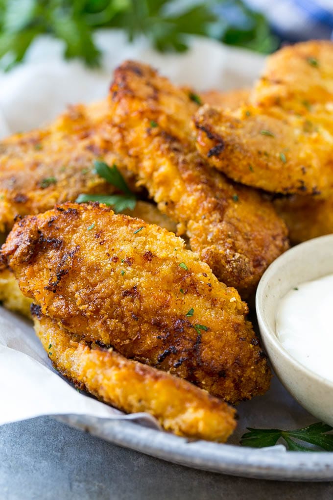 Baked Fried Chicken Recipe | Oven Fried Chicken | Baked Chicken Fingers | Crispy Chicken Fingers #chicken #friedchicken #bakedchicken #ovenfriedchicken #chickenfingers #dinner #fuyos Baked oven fried chicken fingers in a dish with a side of ranch dressing.