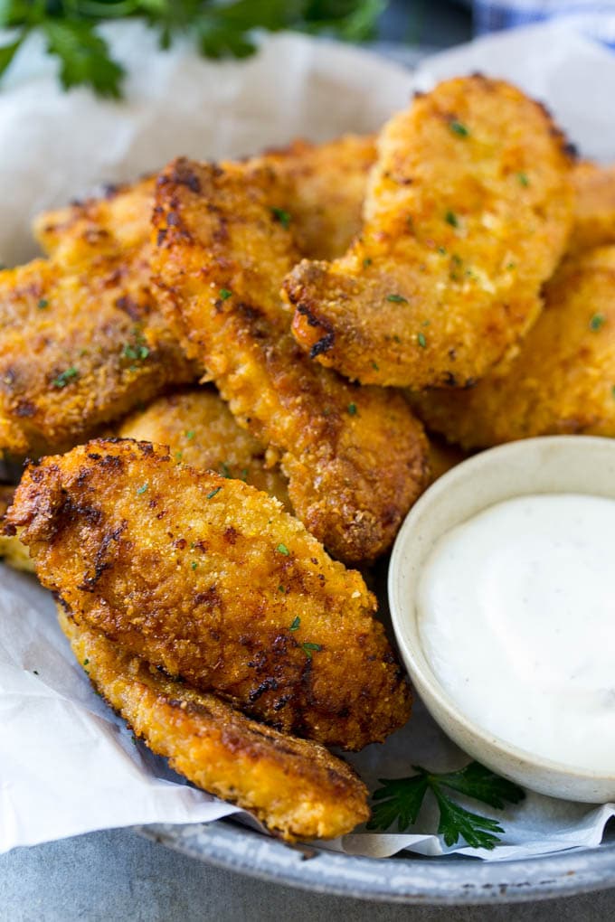 Baked Fried Chicken Recipe | Oven Fried Chicken | Baked Chicken Fingers | Crispy Chicken Fingers #chicken #friedchicken #bakedchicken #ovenfriedchicken #chickenfingers #dinner #fuyos Crispy baked fried chicken fingers on a plate with ranch dip.