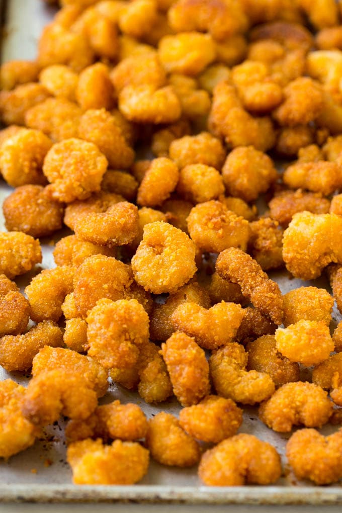 Sesame Shrimp Recipe | Crispy Shrimp | Popcorn Shrimp | Asian Shrimp | Easy Shrimp Recipe #shrimp #fried #friedshrimp #sesameshrimp #crispy #popcornshrimp #chinese #asian #dinner #fuyos A pan of cooked popcorn shrimp.