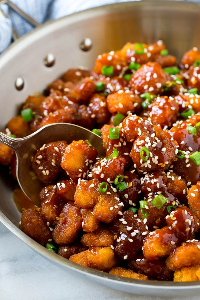 Sesame Shrimp Recipe | Crispy Shrimp | Popcorn Shrimp | Asian Shrimp | Easy Shrimp Recipe #shrimp #fried #friedshrimp #sesameshrimp #crispy #popcornshrimp #chinese #asian #dinner #fuyos A pan of crispy sesame shrimp tossed in an Asian style sauce.