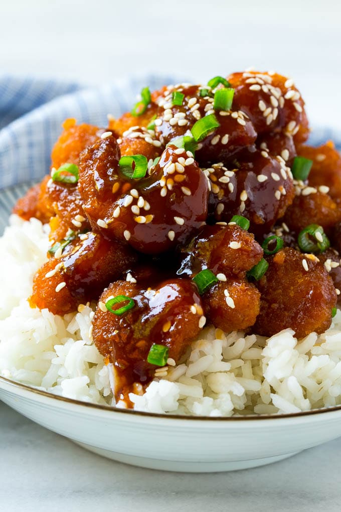 Sesame Shrimp Recipe | Crispy Shrimp | Popcorn Shrimp | Asian Shrimp | Easy Shrimp Recipe #shrimp #fried #friedshrimp #sesameshrimp #crispy #popcornshrimp #chinese #asian #dinner #fuyos A bowl of Asian style crispy sesame shrimp over rice.