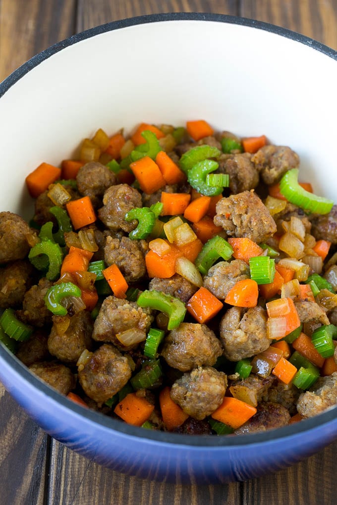 Tortellini Soup Recipe | Sausage Soup | Italian Soup #soup #sausage #pasta #tortellini #dinner #fuyos Sausage, carrots, onion and celery in a pot.