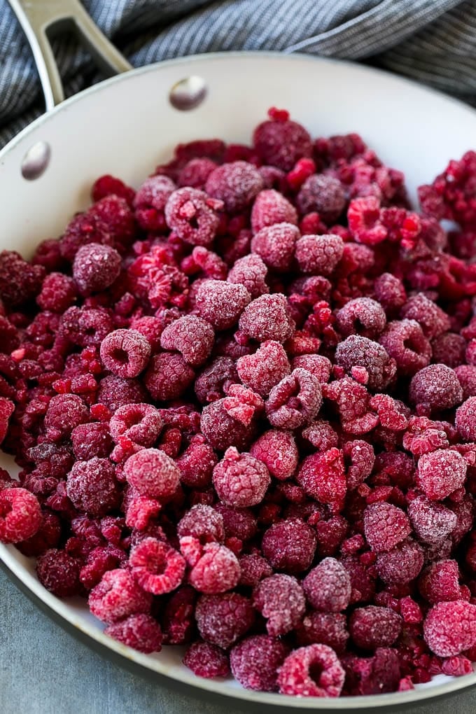 Raspberry Sauce Recipe | Homemade Raspberry Sauce | Raspberry Recipe #raspberries #dessert #fuyos A pan of frozen berries.