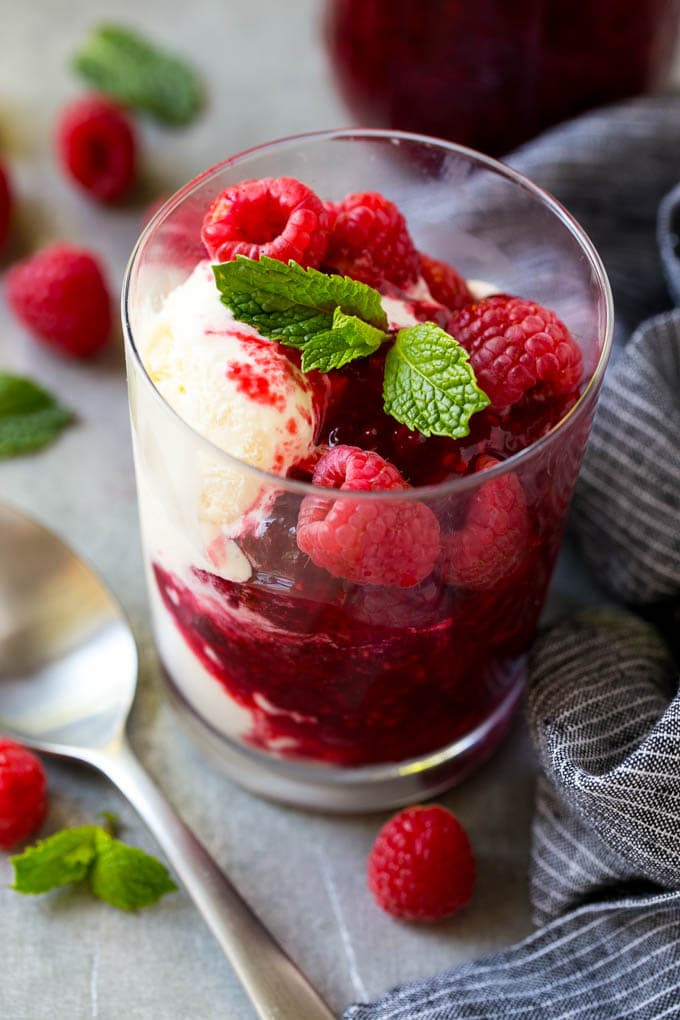 Raspberry Sauce Recipe | Homemade Raspberry Sauce | Raspberry Recipe #raspberries #dessert #fuyos A cup of vanilla ice cream with raspberry sauce and fresh raspberries.