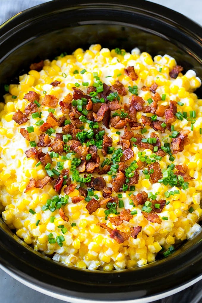 Slow Cooker Creamed Corn Recipe | Easy Creamed Corn Recipe | Slow Cooker Creamed Corn with Bacon | Southern Creamed Corn | Creamed Corn with Cream Cheese #creamedcorn #corn #bacon #crockpot #slowcooker #dinner #fuyos Slow cooker creamed corn topped with bacon and chives.