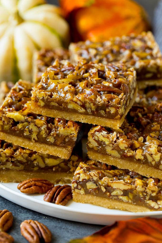 Pecan Pie Bars Recipe #pecans #pie #fall #pecanpie #dessert #thanksgiving #fuyos A serving platter full of pecan pie bars.