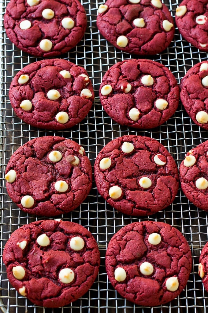 Red Velvet Cookies Recipe | Red Velvet Cookies with White Chocolate Chips | Red Velvet Cake Mix Cookies #redvelvet #cookies #whitechocolate #christmas #fuyos Baked cookies on a wire cooling rack.