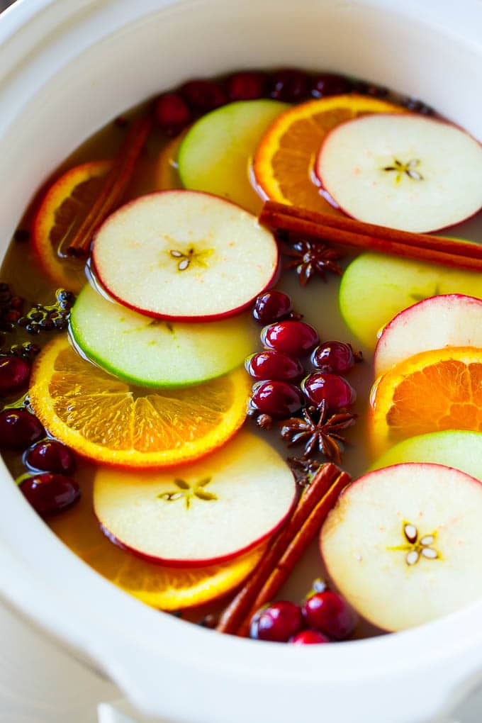 Slow Cooker Apple Cider | Mulled Apple Cider | Crockpot Apple Cider #cider #apple #applecider #drink #crockpot #slowcooker #fuyos Slow cooker apple cider with oranges, apple slices, cinnamon sticks and cranberries.