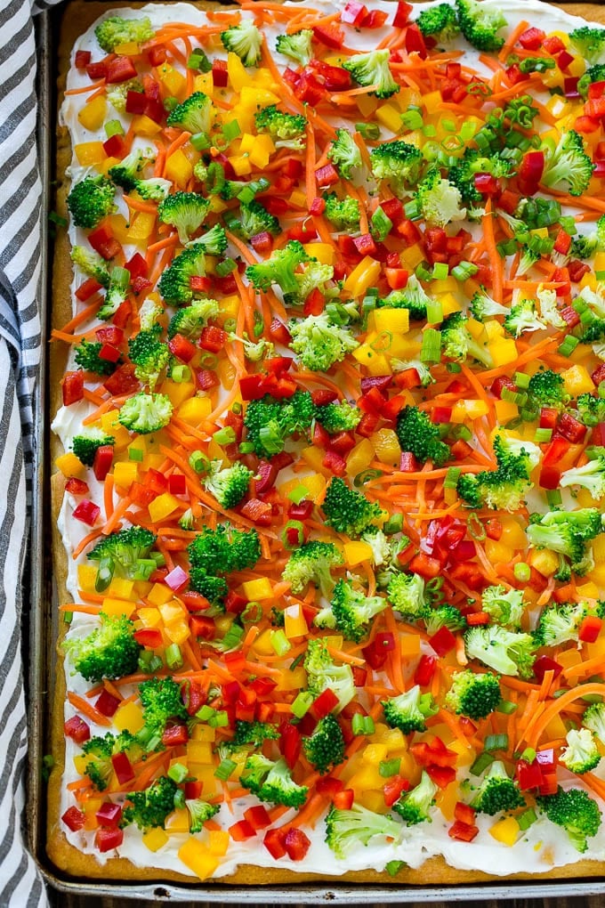 Veggie Pizza Recipe | Crescent Veggie Pizza | Vegetable Pizza Recipe | Holiday Appetizer | Homemade Veggie Pizza #pizza #veggies #vegetarian #appetizer #fuyos A sheet pan of crescent veggie pizza.