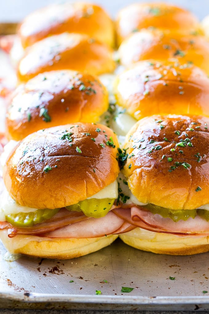 Cuban Sliders Recipe | Cuban Sandwich Recipe | Slider Sandwiches | Ham and Cheese Sliders #sliders #sandwiches #ham #cheese #appetizer #fuyos A sheet pan of Cuban slider sandwiches.