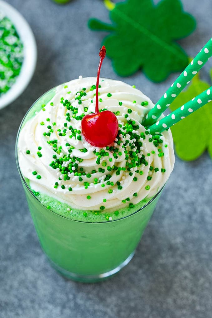 Shamrock Shake Recipe | McDonald's Shamrock Shake | Saint Patrick's Day Drink | Mint Milkshake #milkshake #stpatricksday #saintpatricksday #mint #fuyos A mint Shamrock shake finished off with a swirl of whipped cream sprinkles and a cherry.