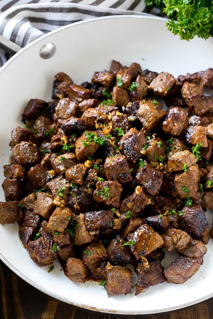 Steak Bites in Garlic Butter Recipe | Garlic Steak | Sirloin Steak Recipe | Steak Appetizer #steak #lowcarb #keto #fuyos #dinner A frying pan of beef cubes tossed in garlic butter.