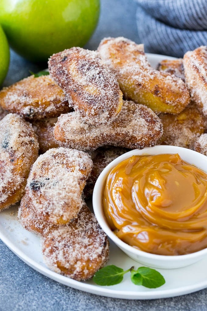 Apple Fries Recipe | Fried Apples Recipe | Cinnamon Sugar Apples | Apple Dessert Recipe #apples #dessert #fuyos #fall A platter of cinnamon sugar coated apple fries served with caramel dip.