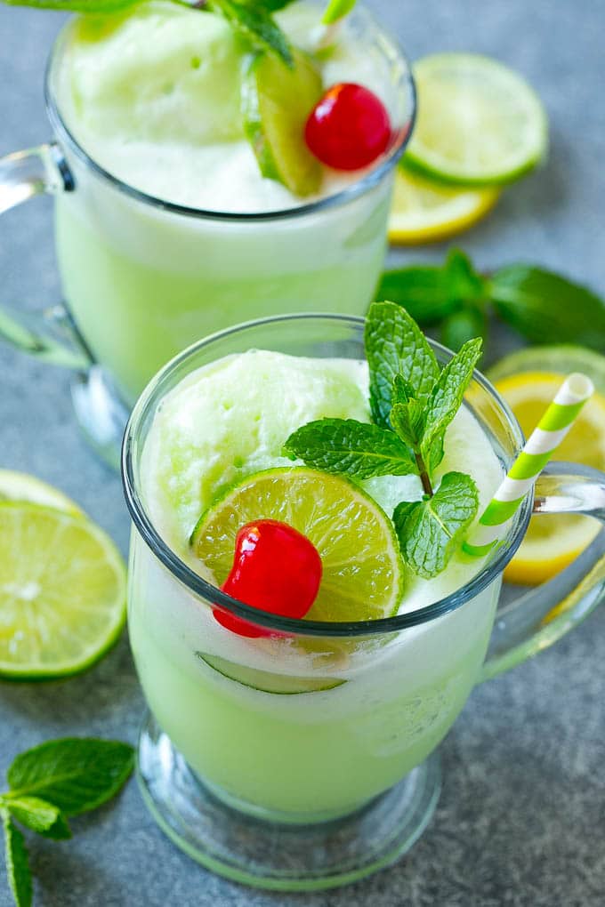Cups of sherbet punch with straws.