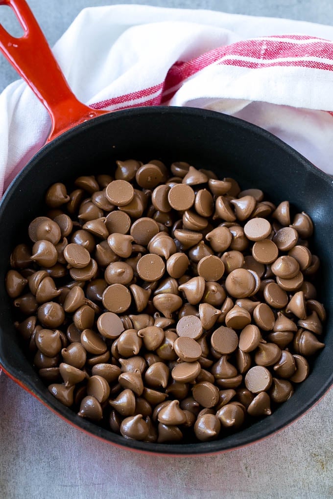 S'mores Dip Recipe | S'mores Skillet | Baked S'mores #smores #dip #chocolate #marshmallow #dessert #fuyos A skillet of milk chocolate chips.