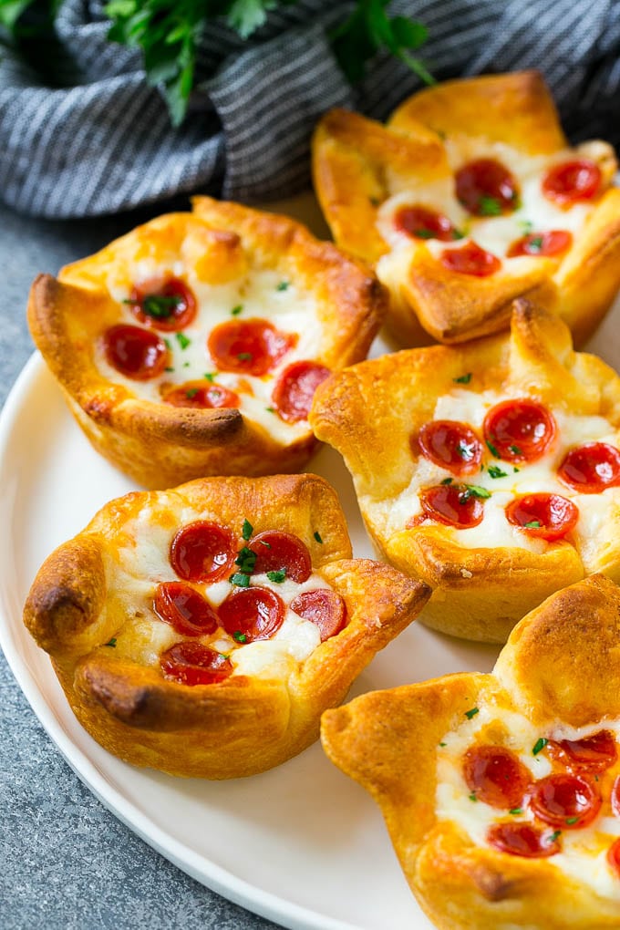 Pizza Muffins Recipe | Pizza Bites | Pizza Cups | Pizza Appetizer #pizza #appetizer #fuyos A plate of pizza muffins made with crescent roll dough, pizza sauce, melted cheese and mini pepperoni.
