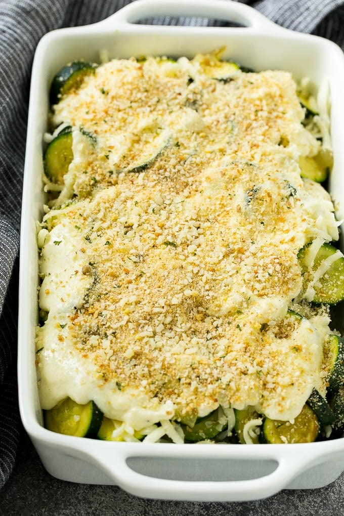 Zucchini Gratin Recipe | Cheesy Zucchini | Baked Zucchini | Easy Zucchini Recipe #zucchini #casserole #cheese #dinner #sidedish #fuyos Zucchini gratin with layers of cheese, sauce and breadcrumbs, ready to go into the oven.