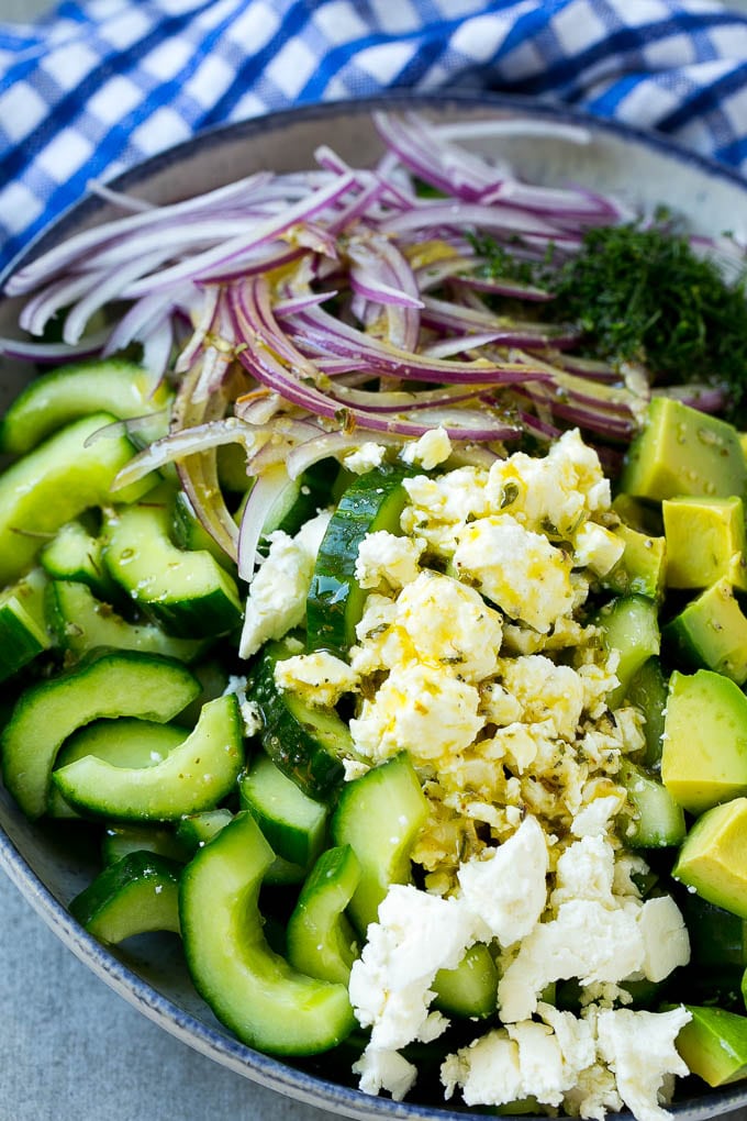 Cucumber Feta Salad Recipe | Cucumber Salad | Feta Cheese Salad | Summer Salad #salad #cucumber #fuyos Veggies and cheese topped with Greek dressing.