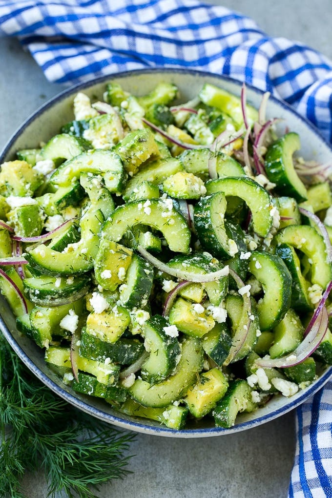 Cucumber Feta Salad Recipe | Cucumber Salad | Feta Cheese Salad | Summer Salad #salad #cucumber #fuyos A bowl of cucumber feta salad with avocado.