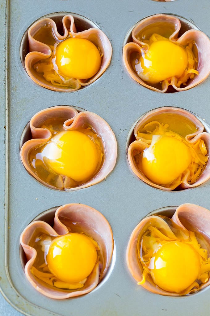 Ham and Egg Cups Recipe | Low Carb Breakfast | Ham and Eggs #ham #eggs #lowcarb #breakfast #fuyos Ham pressed into muffin tins and topped with eggs and cheese.