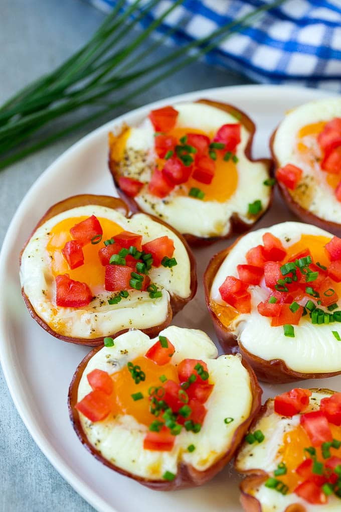 Ham and Egg Cups Recipe | Low Carb Breakfast | Ham and Eggs #ham #eggs #lowcarb #breakfast #fuyos A plate of ham cups filled with eggs and cheese.