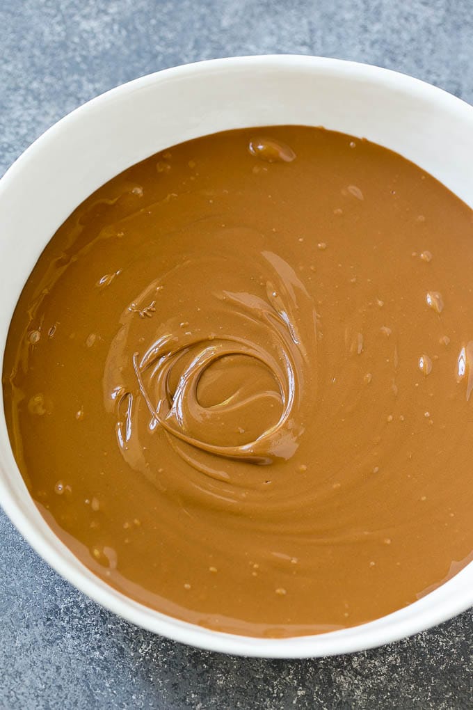 Haystack Cookies Recipe | No Bake Cookies | Chow Mein Noodle Cookies #nobakecookies #cookies #recipe #chocolate #fuyos A bowl of melted milk chocolate chips and butterscotch chips.