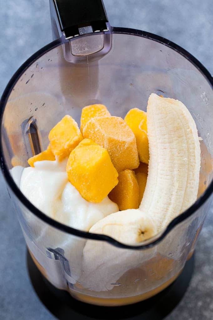 Fruit, yogurt and juice in a blender.