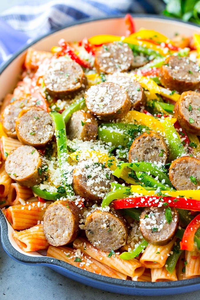 Sausage and Pepper Pasta Recipe | Italian Sausage Recipe | Sausage and Peppers | Easy Pasta #pasta #sausage #peppers #dinner #fuyos Sausage and pepper pasta with sliced Italian sausage, red and yellow bell peppers and grated parmesan cheese.