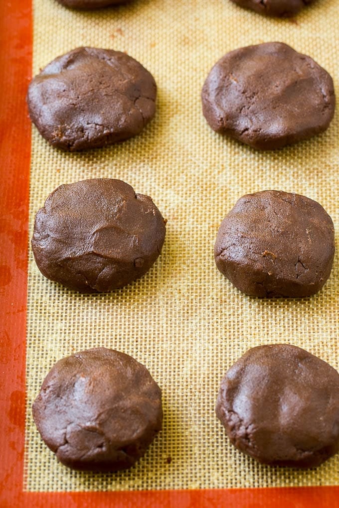 Nutella Cookies Recipe | Nutella Stuffed Cookies | Chocolate Cookies #nutella #chocolate #cookies #baking #dessert #fuyos Nutella cookie dough on a baking sheet.