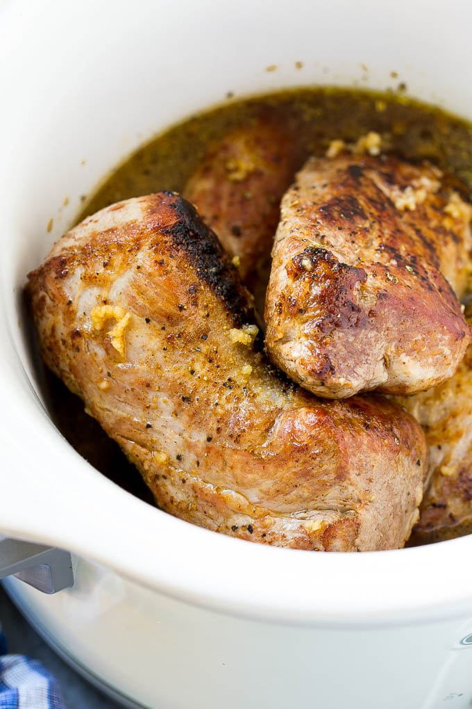Slow Cooker Pork Tenderloin Recipe | Crock Pot Pork Tenderloin | Easy Pork Tenderloin #slowcooker #crockpot #pork #dinner #fuyos Seared pork tenderloin in a slow cooker with seasonings.