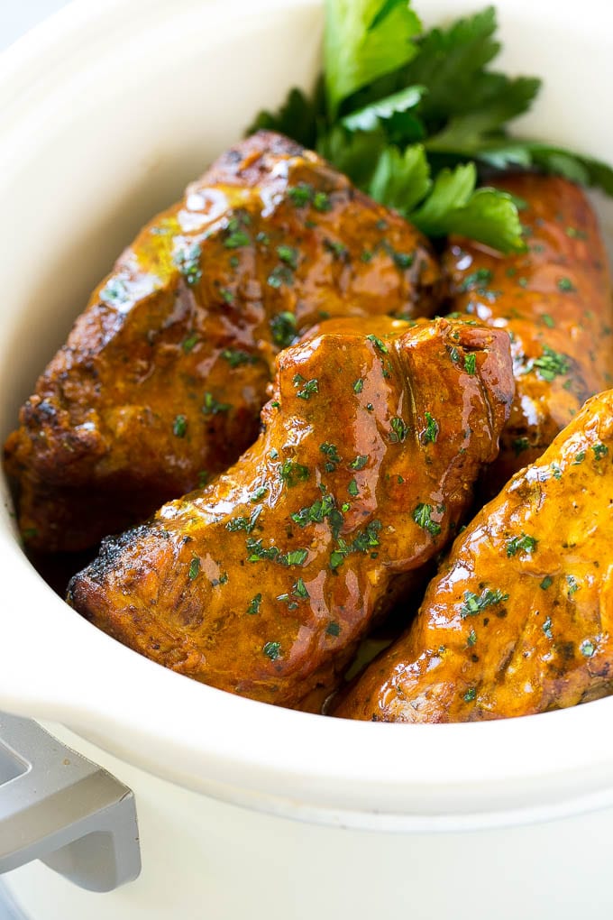 Slow Cooker Pork Tenderloin Recipe | Crock Pot Pork Tenderloin | Easy Pork Tenderloin #slowcooker #crockpot #pork #dinner #fuyos Slow cooker pork tenderloins coated with sauce, inside a crock pot.
