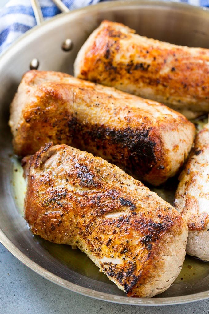 Slow Cooker Pork Tenderloin Recipe | Crock Pot Pork Tenderloin | Easy Pork Tenderloin #slowcooker #crockpot #pork #dinner #fuyos Seared pork tenderloin in a skillet.