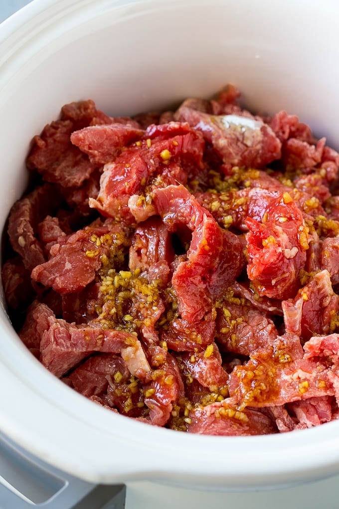 Slow Cooker Korean Beef Recipe | Korean Beef | Flank Steak Recipe #dinner #beef #slowcooker #crockpot #asian #fuyos Flank steak strips in a soy, ginger and garlic sauce.