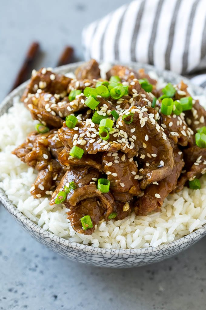 Slow Cooker Korean Beef Recipe | Korean Beef | Flank Steak Recipe #dinner #beef #slowcooker #crockpot #asian #fuyos Slow cooker Korean beef served over steamed rice.