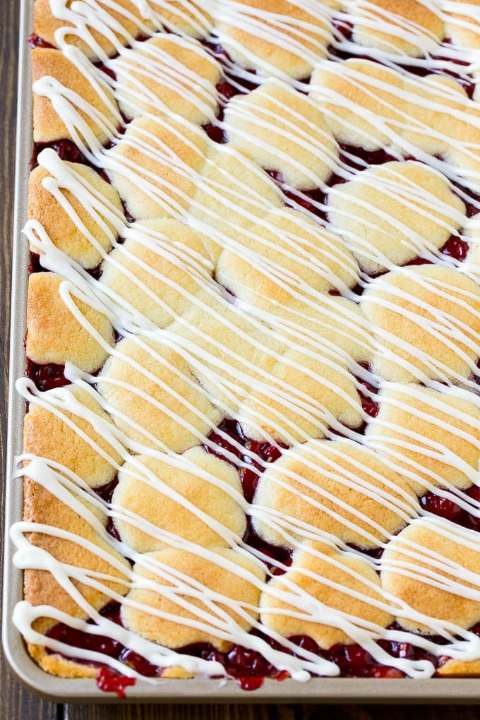 Cherry Bars Recipe | Cherry Pie Bars | Cherry Cookies | Bar Cookies #cookies #bars #cherry #baking #dessert #sweets #fuyos Cherry bars topped with vanilla glaze.